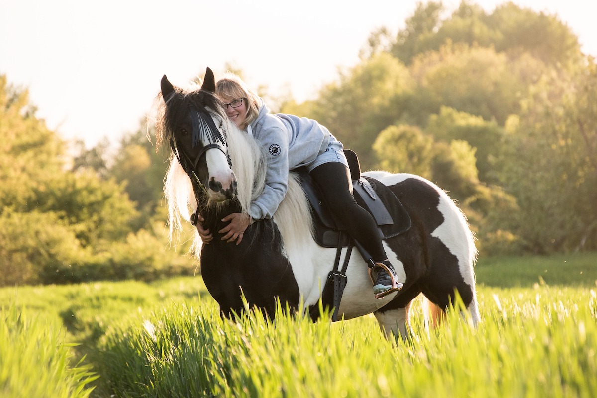Woman Riding Horse